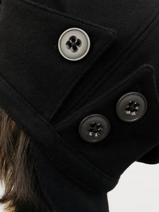 Model styling the PETAL beret by hand