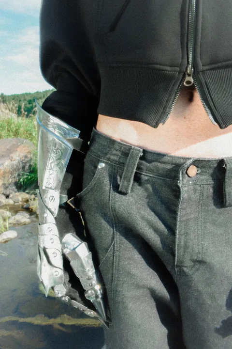 Close detail of the KEY hoodie front pocket and hardware