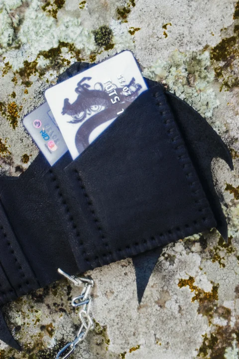 Close detail of the DRAGON wallet leather body and cut edge