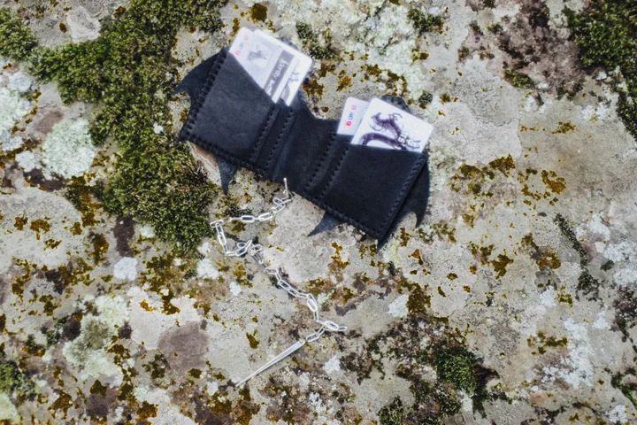 DRAGON wallet campaign detail showing the black leather shape